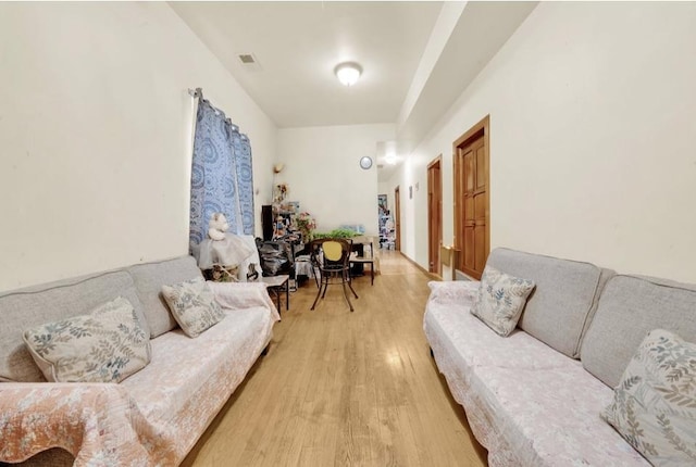 2629 W Luther St, Chicago, IL 60608 - living area featuring light wood finished floors and visible vents