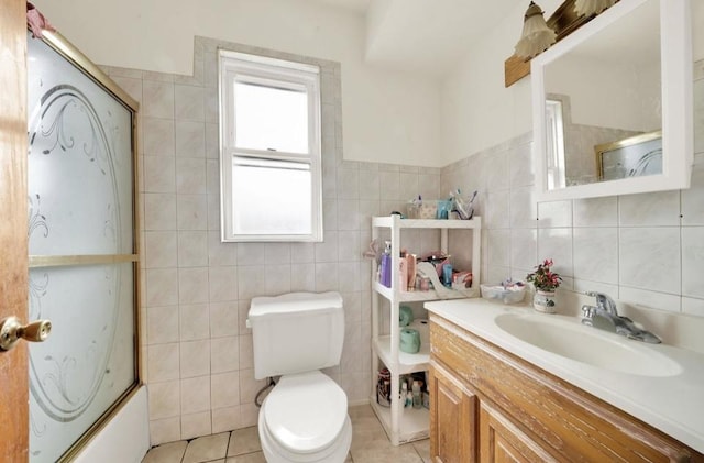 2629 W Luther St, Chicago, IL 60608 - full bath featuring toilet, vanity, tile patterned floors, and tile walls