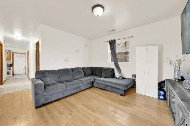 2629 W Luther St, Chicago, IL 60608 - living room with visible vents and light wood-style floors