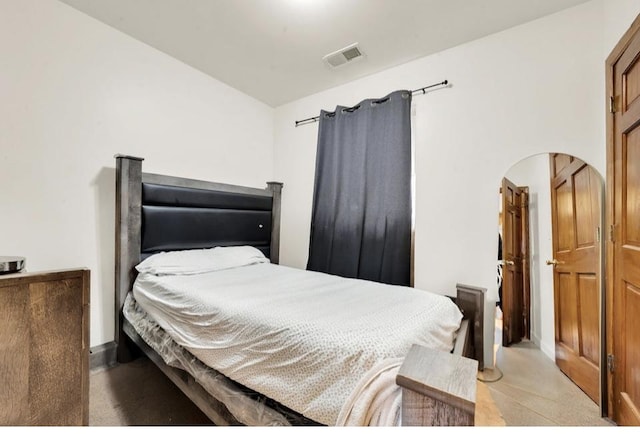2629 W Luther St, Chicago, IL 60608 - bedroom featuring arched walkways, visible vents, and baseboards