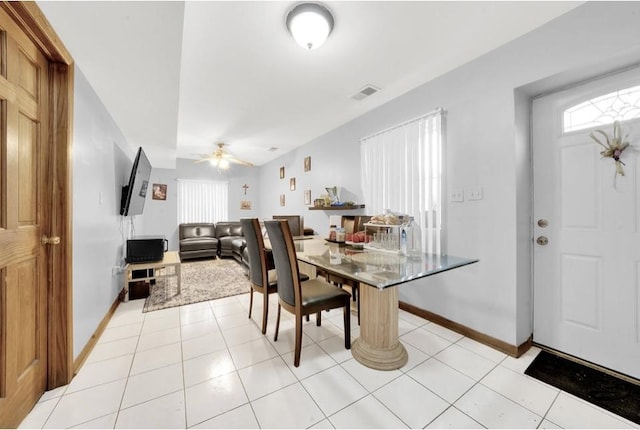2629 W Luther St, Chicago, IL 60608 - dining room with a ceiling fan, visible vents, a wealth of natural light, and light tile patterned floors
