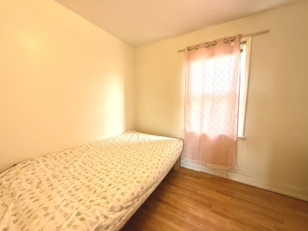 2919 S Quinn St, Chicago, IL 60608 - bedroom featuring baseboards and wood finished floors