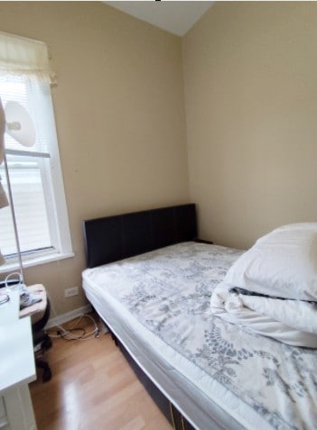 2919 S Quinn St, Chicago, IL 60608 - bedroom featuring vaulted ceiling and wood finished floors