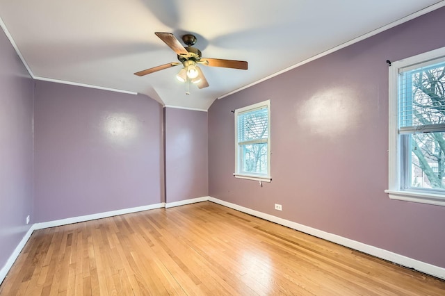 unfurnished room with a ceiling fan, light wood-style flooring, ornamental molding, and a healthy amount of sunlight