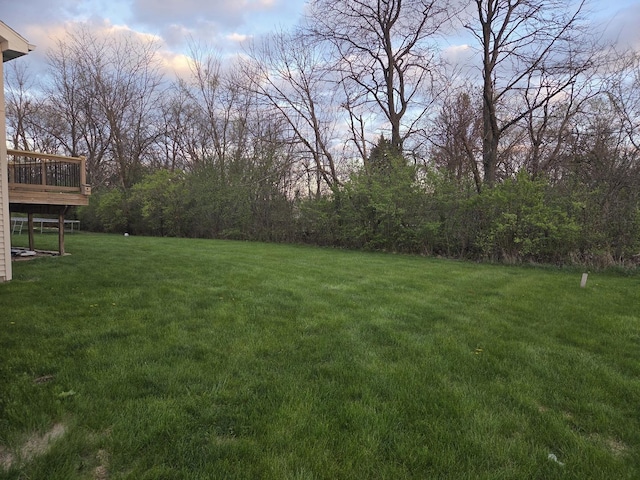 view of yard with a wooden deck