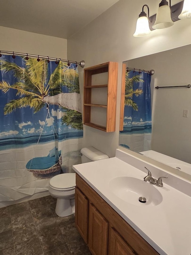 bathroom with toilet and vanity