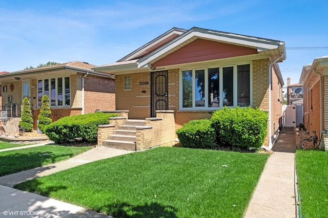 7046 W 63rd Pl, Chicago, IL 60638 - bungalow-style house featuring brick siding and a front yard