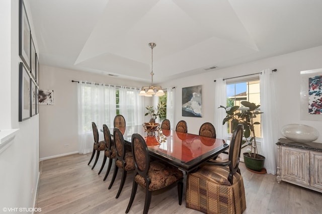1952 Crenshaw Cir Unit 1952, Vernon Hills, IL 60061 - dining room with a raised ceiling, light wood-type flooring, healthy amount of natural light, and a chandelier