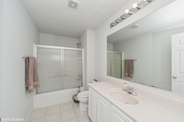 1952 Crenshaw Cir Unit 1952, Vernon Hills, IL 60061 - full bathroom with vanity, tile patterned flooring, and bath / shower combo with glass door