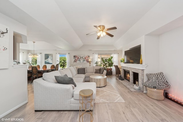 1952 Crenshaw Cir Unit 1952, Vernon Hills, IL 60061 - living room featuring light wood-type flooring, a ceiling fan, plenty of natural light, and a fireplace