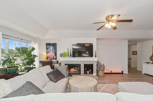 1952 Crenshaw Cir Unit 1952, Vernon Hills, IL 60061 - living room with a fireplace, wood finished floors, ceiling fan, and a raised ceiling