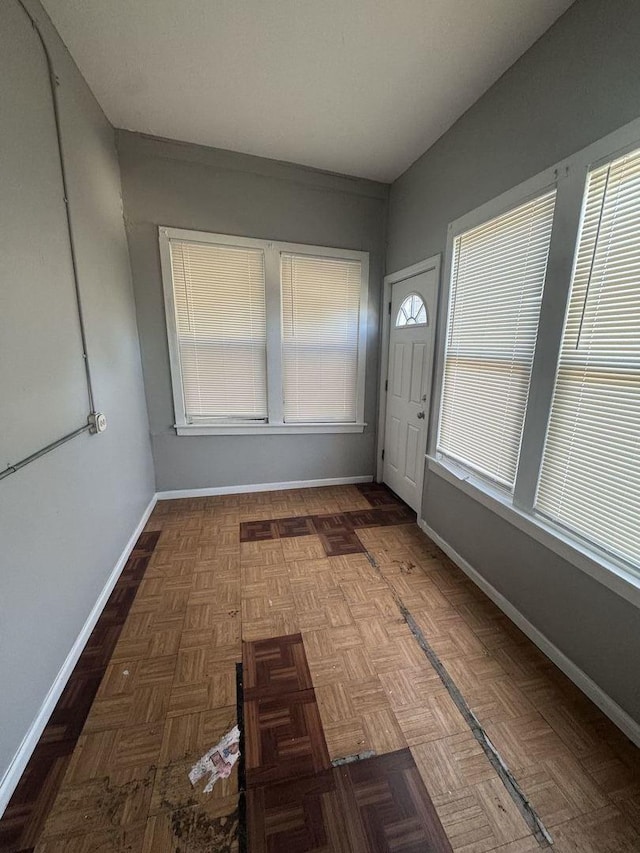 entrance foyer featuring baseboards