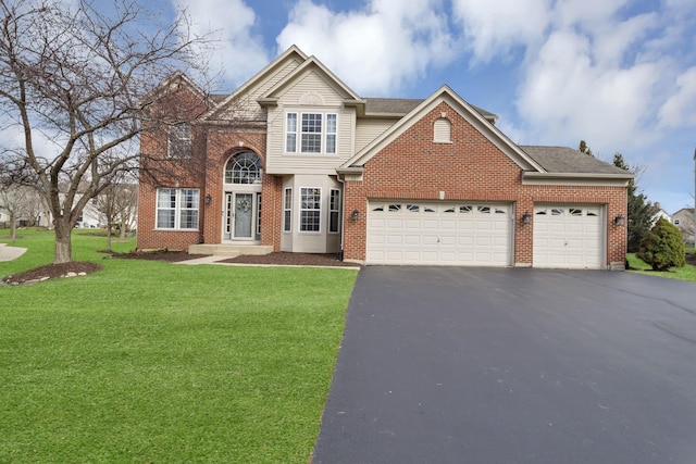 traditional home with brick siding, a front lawn, driveway, and a garage