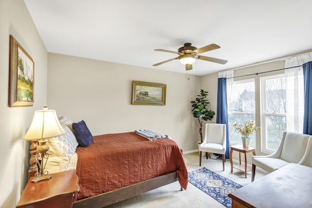 bedroom with carpet, baseboards, and ceiling fan