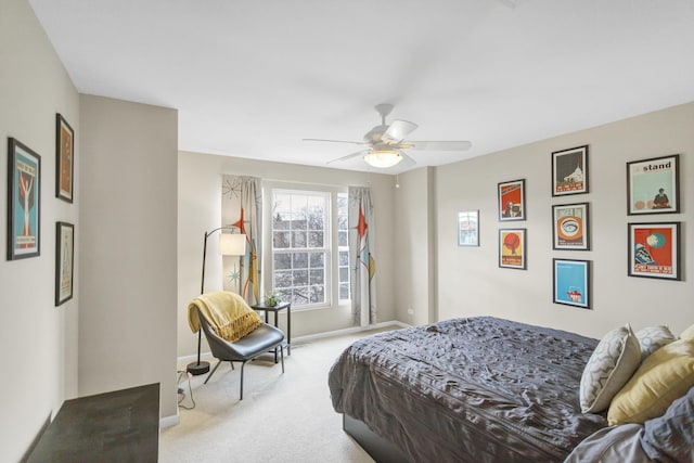 bedroom featuring baseboards, a ceiling fan, and carpet
