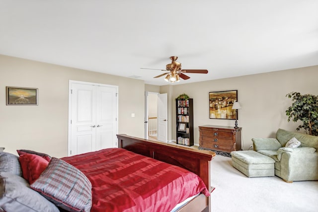 bedroom featuring a ceiling fan, carpet flooring, and a closet