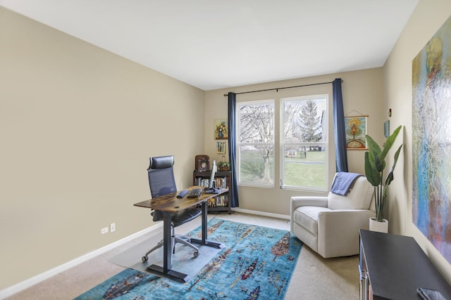 home office with light colored carpet and baseboards