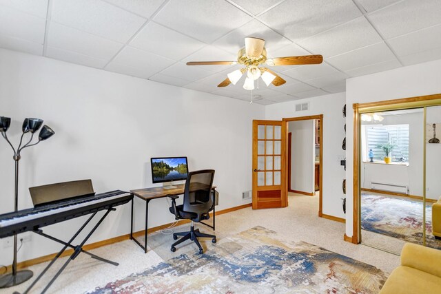 home office featuring a baseboard radiator, a paneled ceiling, baseboards, and ceiling fan