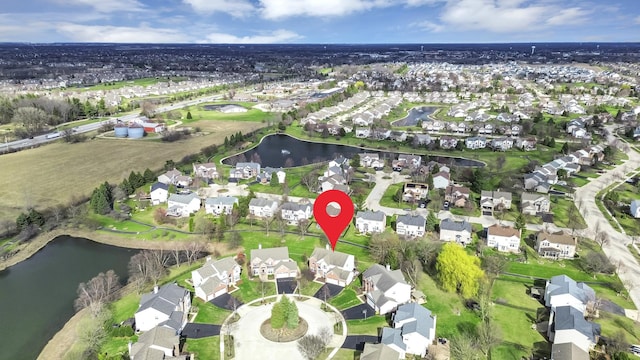bird's eye view with a water view and a residential view