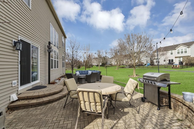 view of patio / terrace with a residential view, a grill, fence, outdoor dining area, and an outdoor living space