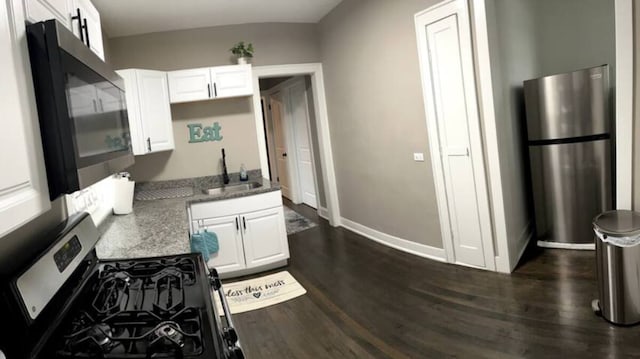 5413 N Artesian Ave, Chicago, IL 60625 - kitchen featuring stainless steel appliances, white cabinets, dark wood-type flooring, and light stone counters