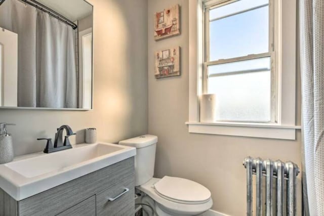 5413 N Artesian Ave, Chicago, IL 60625 - bathroom with radiator and vanity