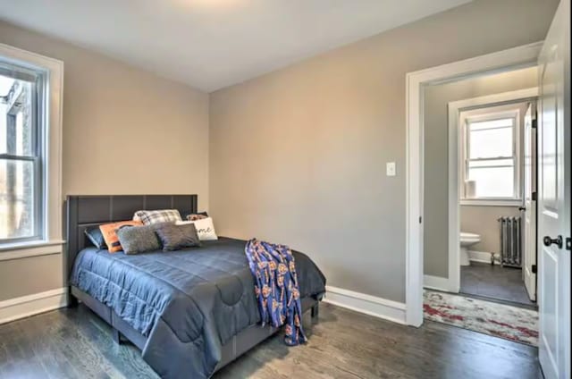5413 N Artesian Ave, Chicago, IL 60625 - bedroom featuring multiple windows, wood finished floors, and radiator heating unit