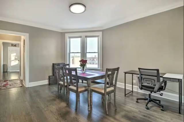 5413 N Artesian Ave, Chicago, IL 60625 - dining room with dark wood-type flooring, ornamental molding, and radiator heating unit