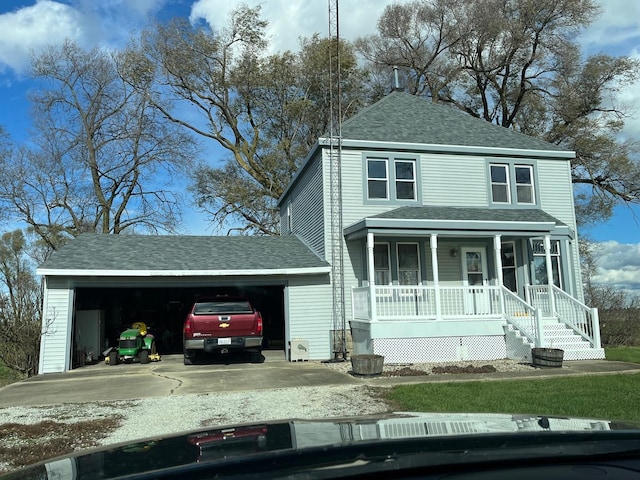 1534 E 1600 N Rd, Roberts, IL 60962 - view of front of home with a porch, a garage, a shingled roof, and concrete driveway