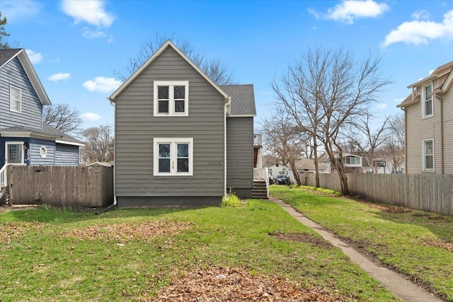 3015 Emmaus Ave, Zion, IL 60099 - rear view of property with a lawn and fence
