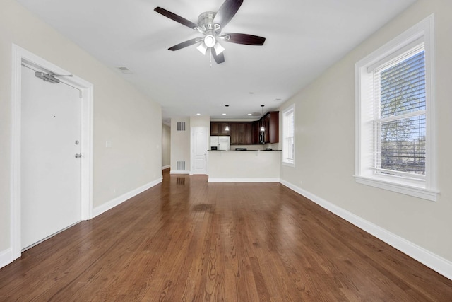 4538 S Calumet Ave Unit 3N, Chicago, IL 60653 - unfurnished living room featuring dark wood-type flooring, visible vents, and ceiling fan