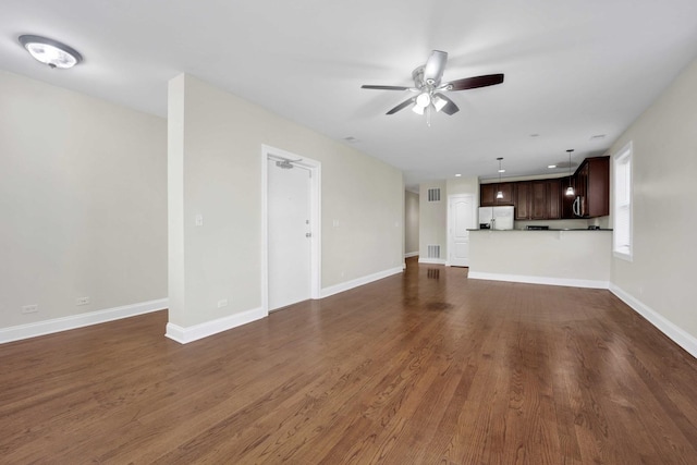 4538 S Calumet Ave Unit 3N, Chicago, IL 60653 - unfurnished living room featuring dark wood-type flooring, ceiling fan, and visible vents