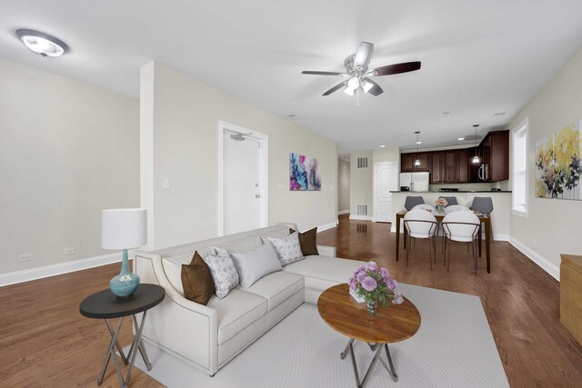 4538 S Calumet Ave Unit 3N, Chicago, IL 60653 - living area featuring dark wood-style floors, visible vents, and ceiling fan