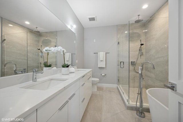 full bath featuring visible vents, a sink, a shower stall, and double vanity