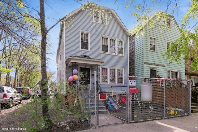 8119 S Escanaba Ave, Chicago, IL 60617 - view of front of house featuring a gate