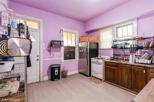 8119 S Escanaba Ave, Chicago, IL 60617 - kitchen featuring stainless steel appliances and light wood-type flooring
