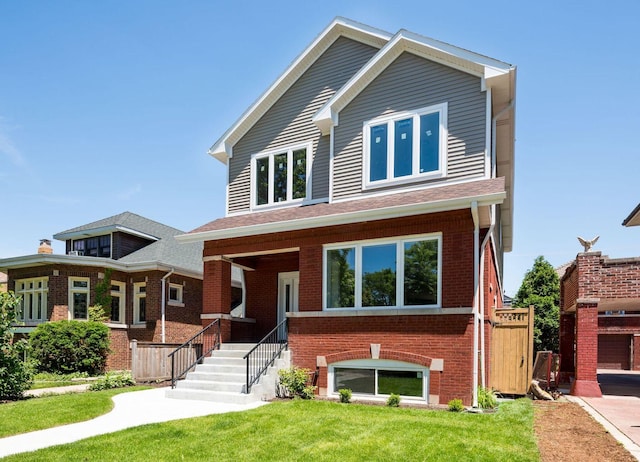 view of front of house featuring a front lawn and brick siding