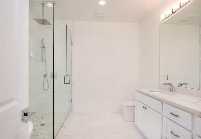 bathroom featuring recessed lighting, a shower stall, toilet, vanity, and baseboards