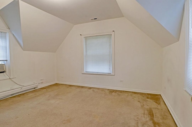 1811 Emerson St, Evanston, IL 60201 - additional living space featuring vaulted ceiling, carpet floors, visible vents, and baseboards