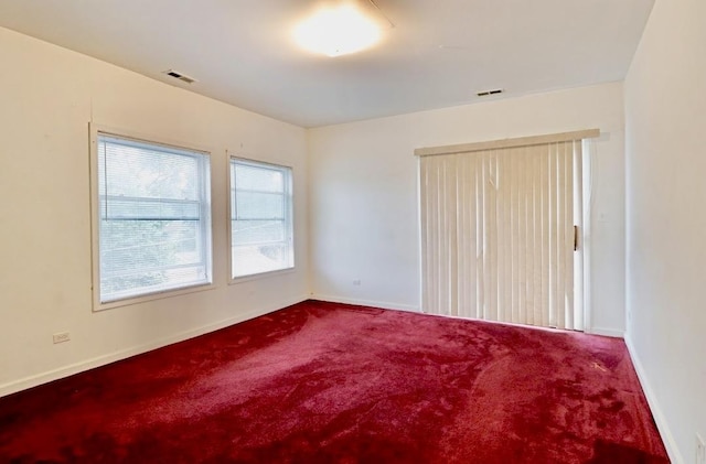 1811 Emerson St, Evanston, IL 60201 - empty room with visible vents, carpet flooring, and baseboards