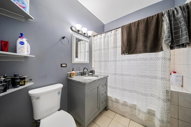 bathroom featuring vanity, a shower with curtain, toilet, lofted ceiling, and tile patterned flooring