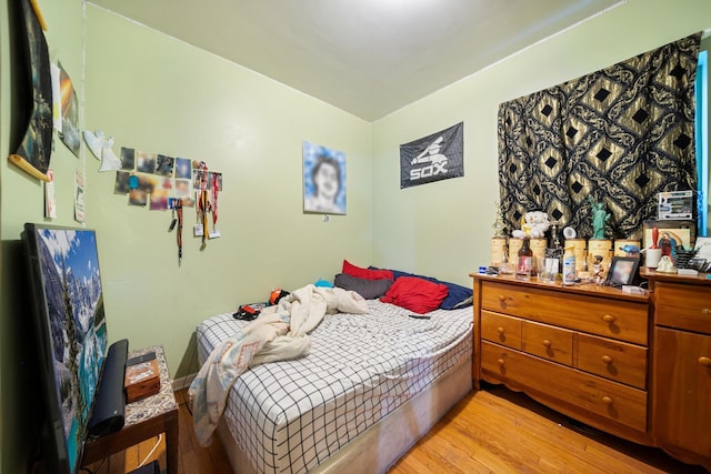 bedroom with light wood-style floors