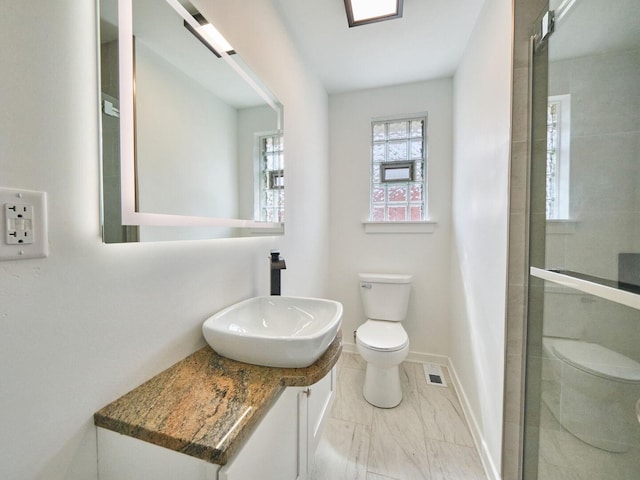 14923 Wood St, Harvey, IL 60426 - full bathroom with visible vents, toilet, vanity, baseboards, and tiled shower