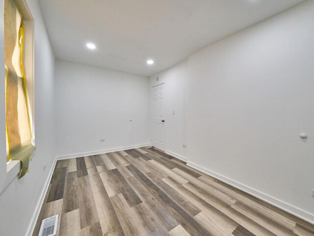 14923 Wood St, Harvey, IL 60426 - spare room featuring visible vents, baseboards, wood finished floors, and recessed lighting