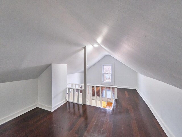 14923 Wood St, Harvey, IL 60426 - additional living space with wood finished floors, vaulted ceiling, and baseboards