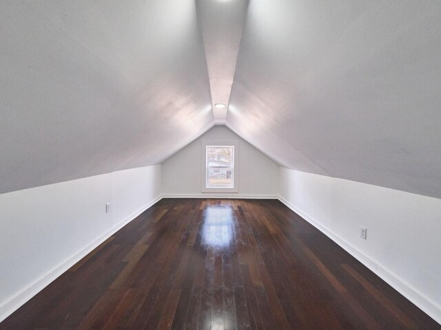 14923 Wood St, Harvey, IL 60426 - additional living space with wood-type flooring, baseboards, and lofted ceiling