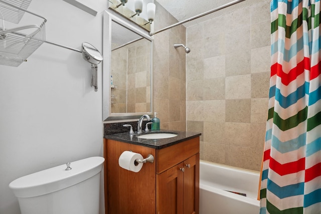 bathroom with vanity, shower / bath combo, and toilet