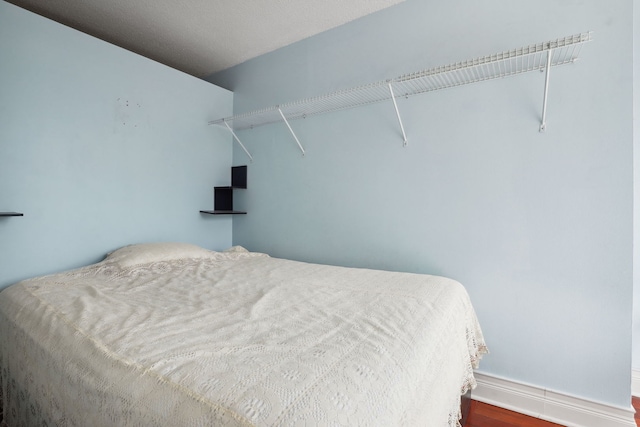 bedroom featuring baseboards