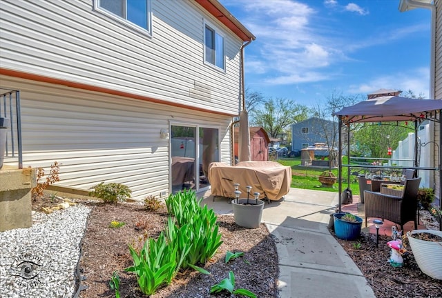 exterior space featuring a gazebo and grilling area
