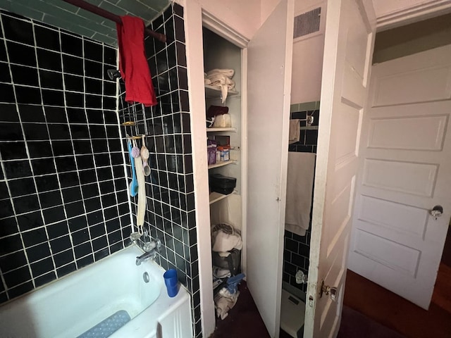 11916 S Harvard Ave, Chicago, IL 60628 - full bath with shower / bathtub combination and tile walls